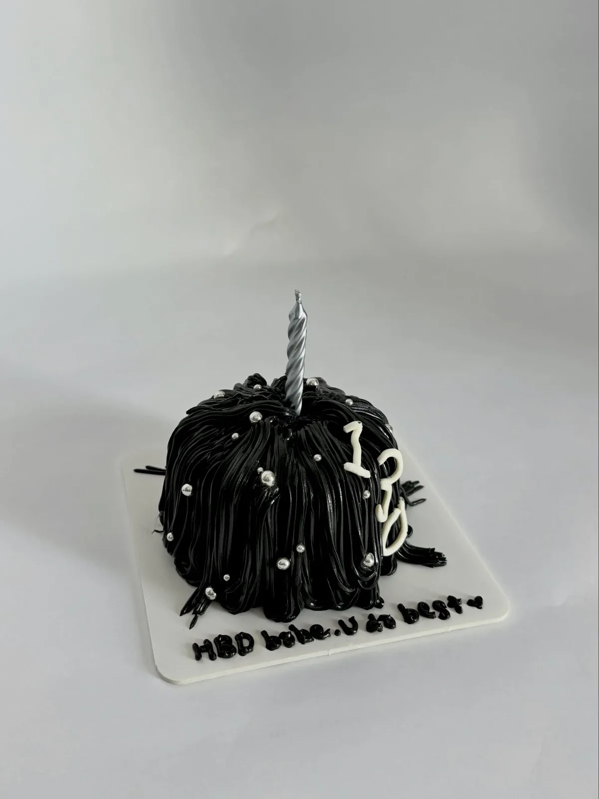 Black piped strand cake with white pearls and candle, custom cake made in Streatham SW16 - Danine Cakes