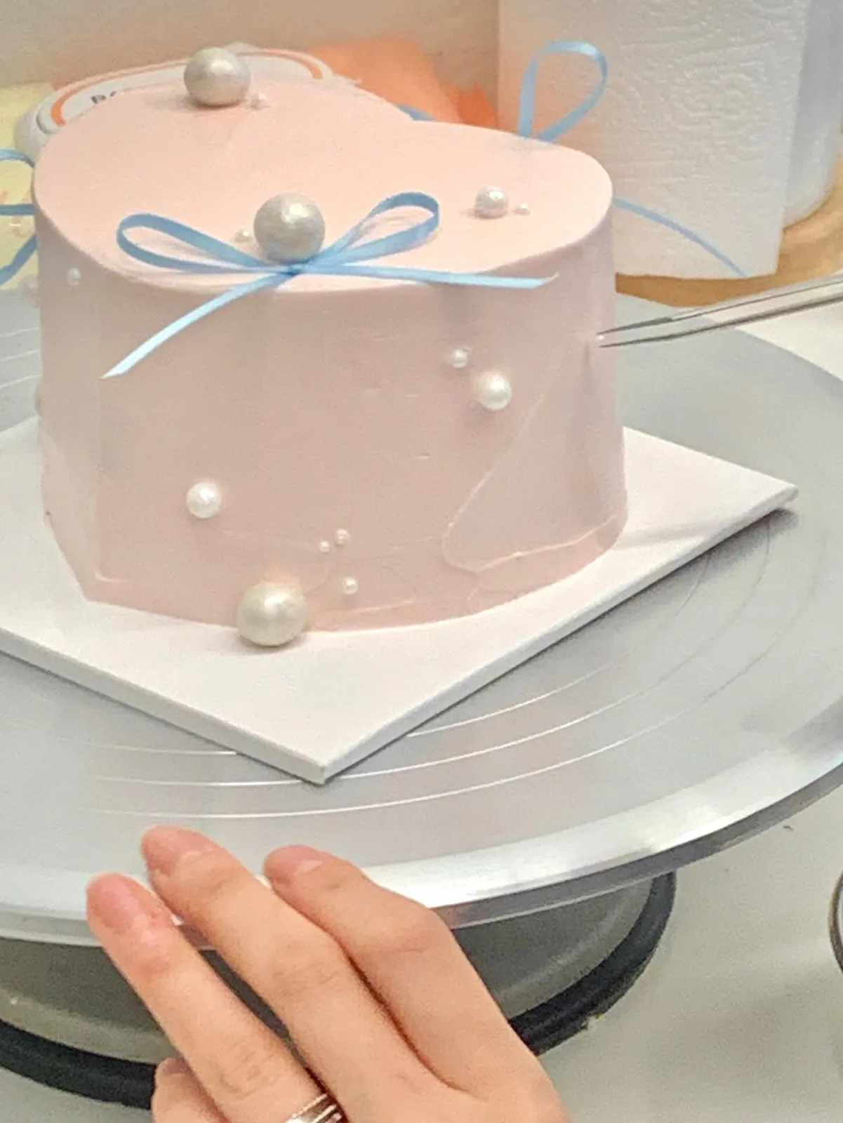 Blush pink cake with pearls and blue satin bow, custom cake made in Streatham SW16 - Danine Cakes
