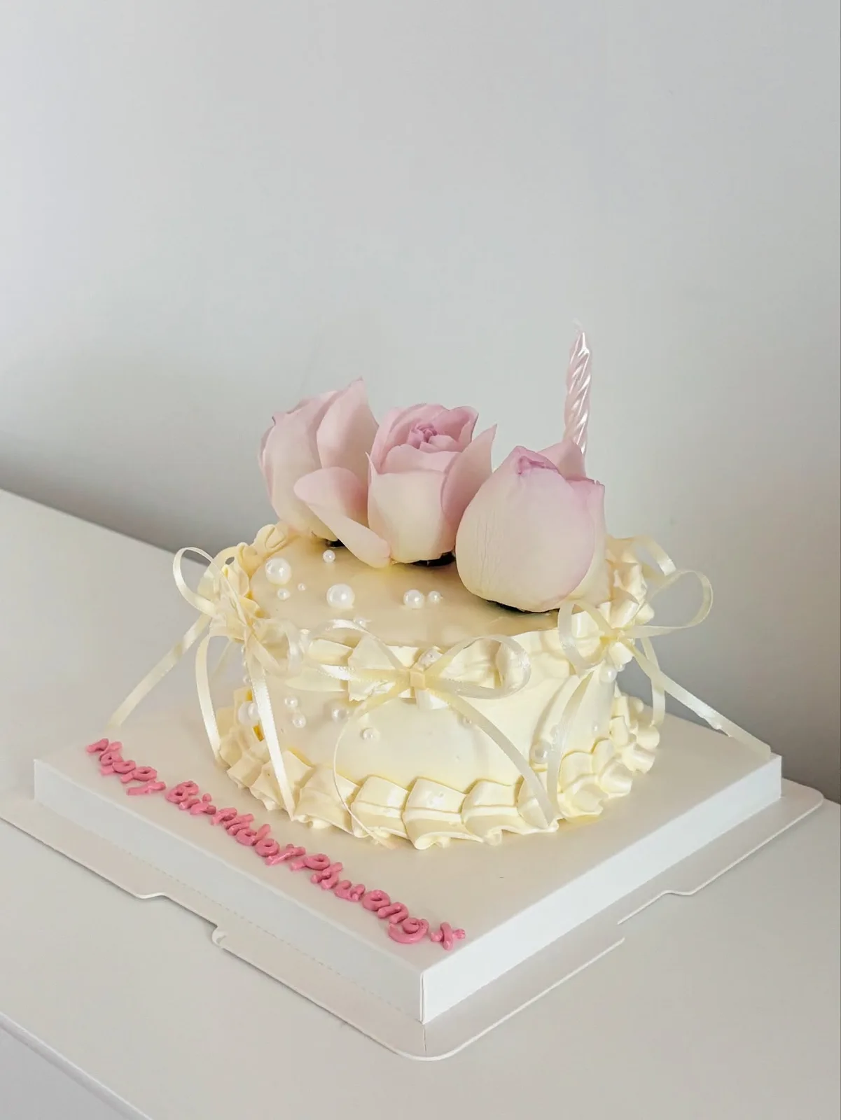 Cream cake with piped tulips, pearls and candle, custom cake made in Streatham SW16 - Danine Cakes