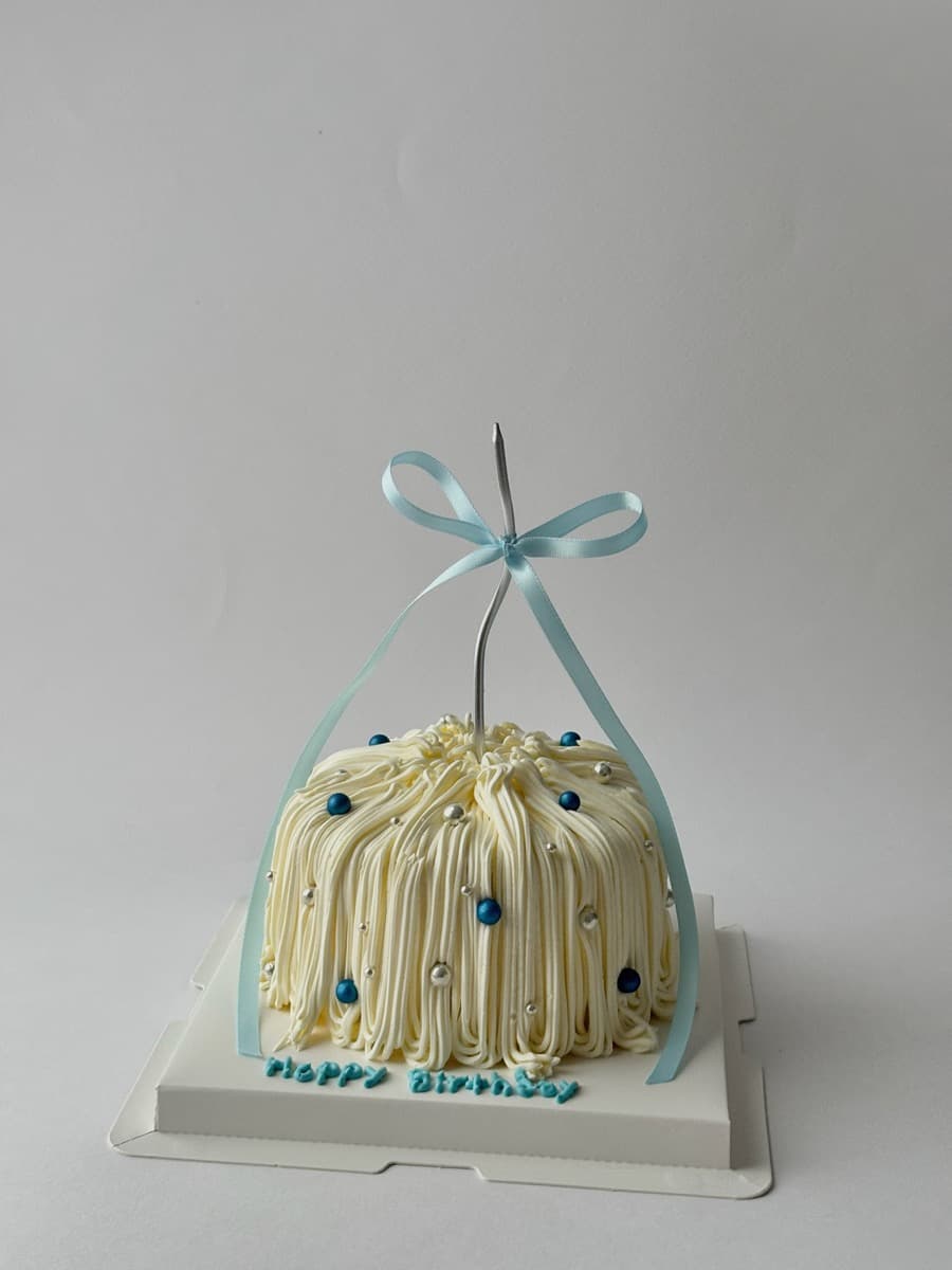Ivory dome with blue pearl & ribbon finish