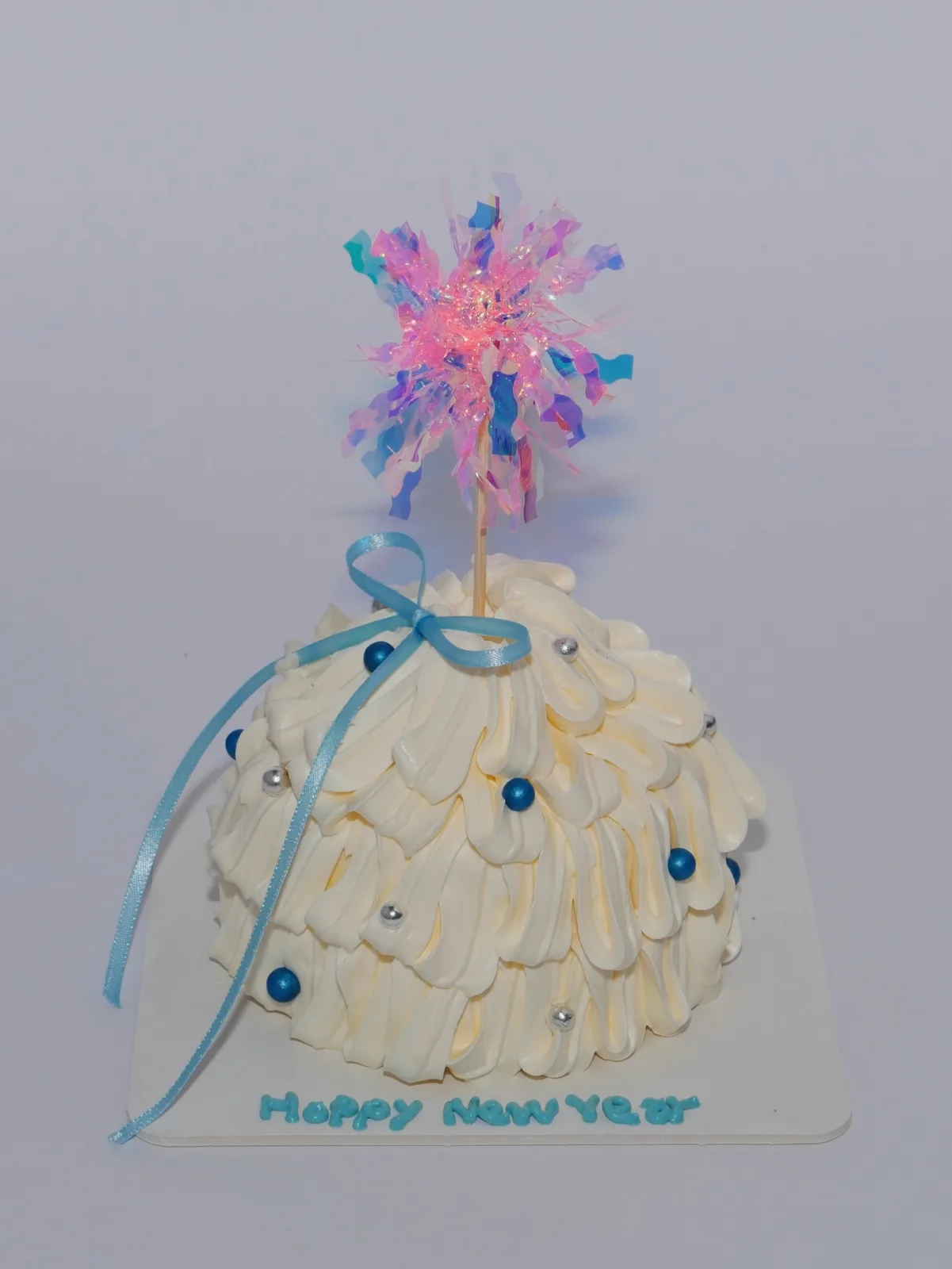 Ivory cake with pearls and blue ribbon streamers, Korean-inspired custom cake handmade in Streatham, London