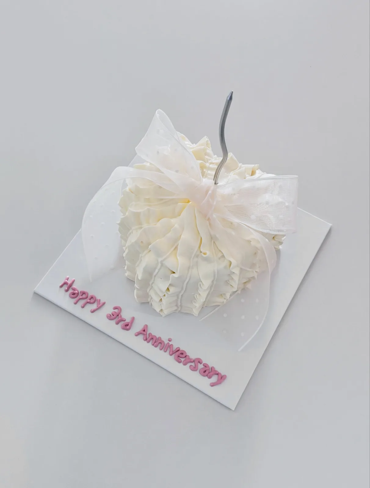Ivory piped dome cake with anniversary lettering, bespoke celebration cake from Danine Cakes, South London