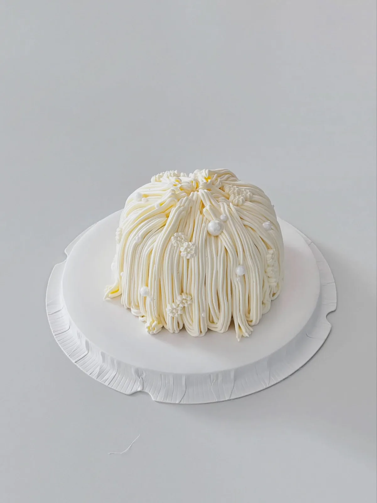 Ivory piped dome cake with pearl trim, bespoke celebration cake from Danine Cakes, South London