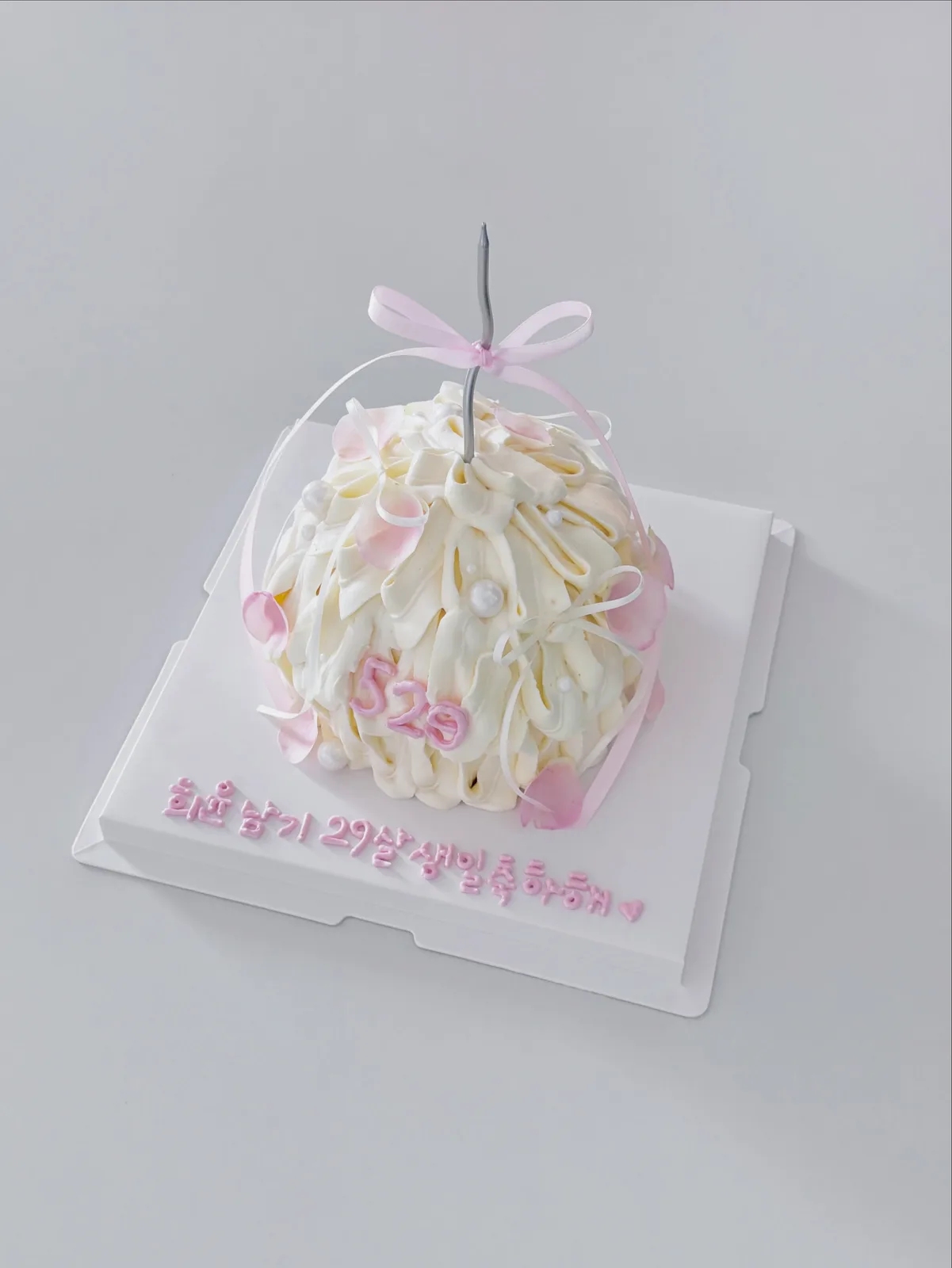 Ivory piped petal cake with Korean lettering, bespoke celebration cake from Danine Cakes, South London