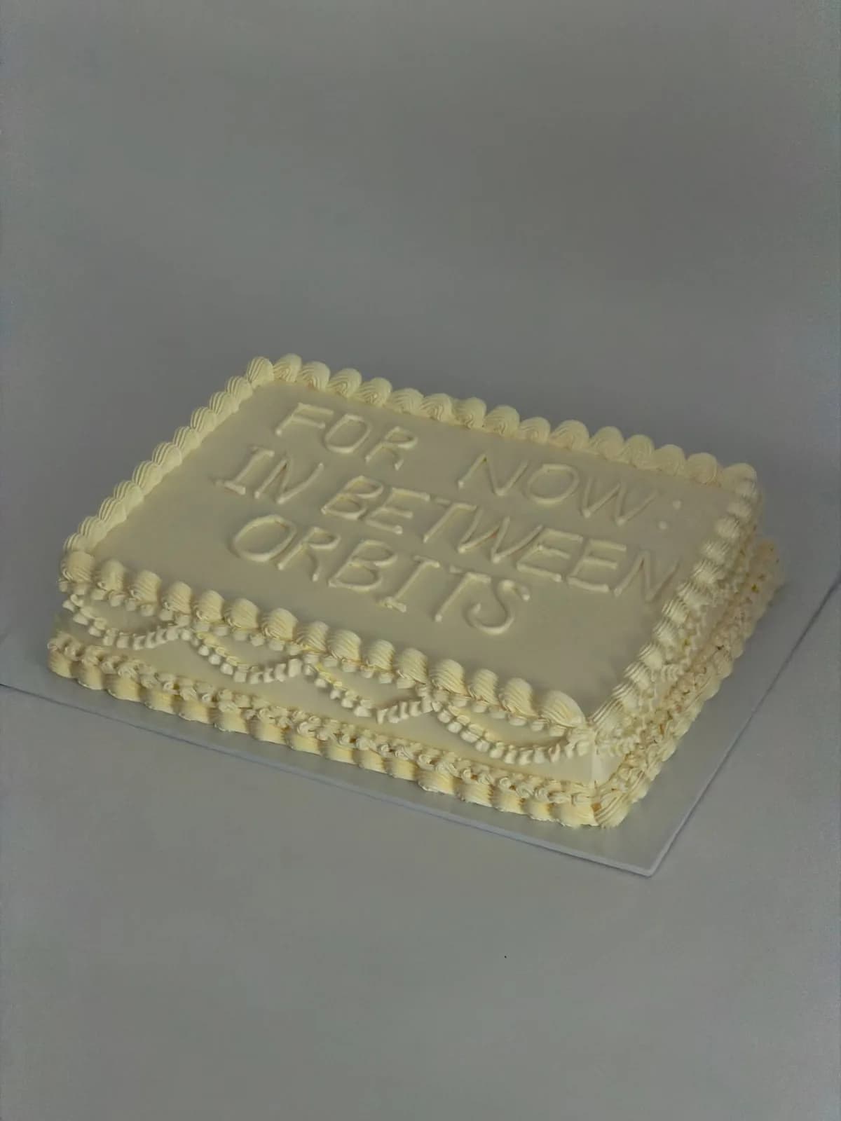 Ivory square cake with piped lettering and pearl border, Korean-inspired custom cake handmade in Streatham, London