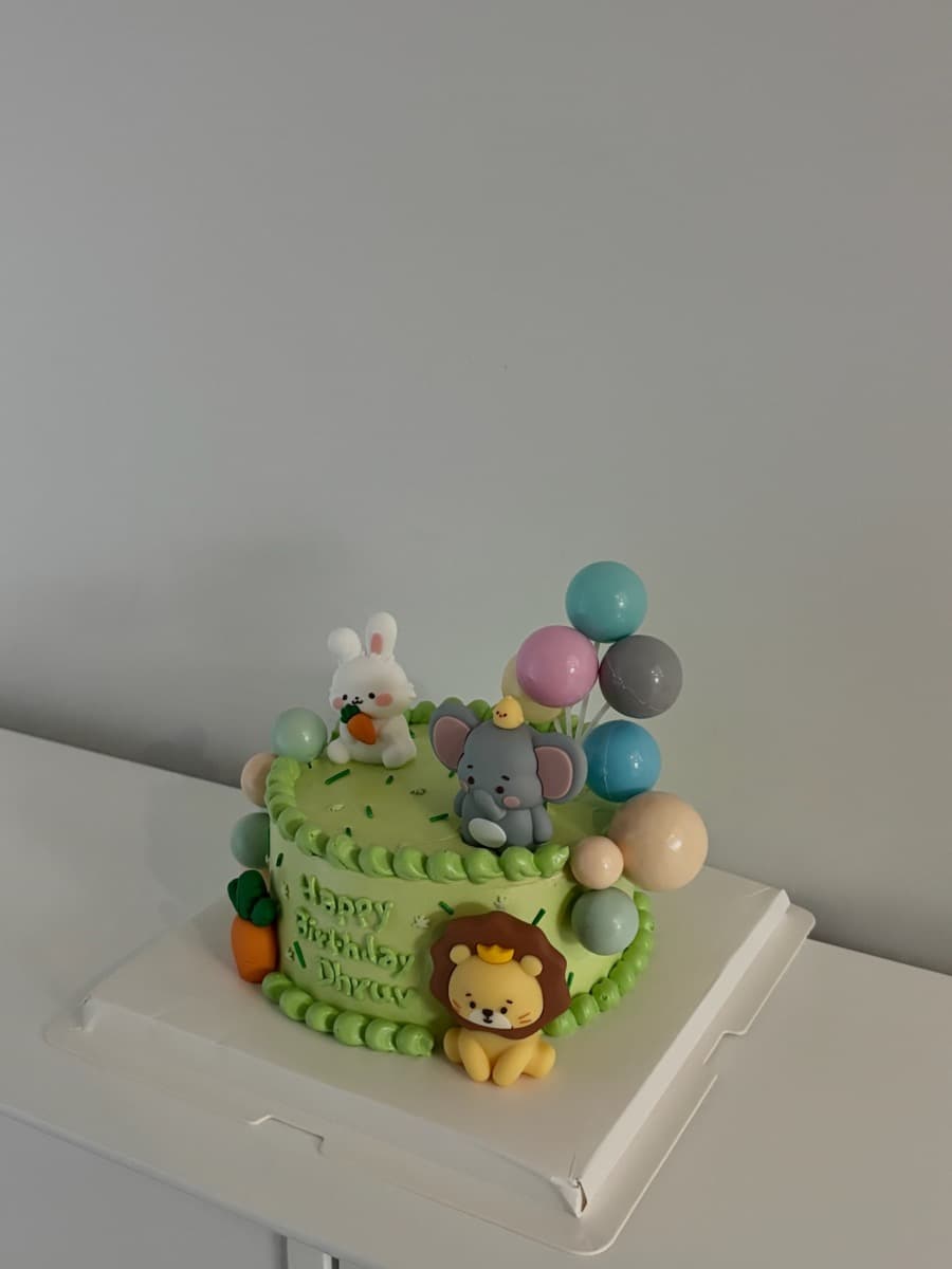 Lion, elephant & bunny in a birthday jungle