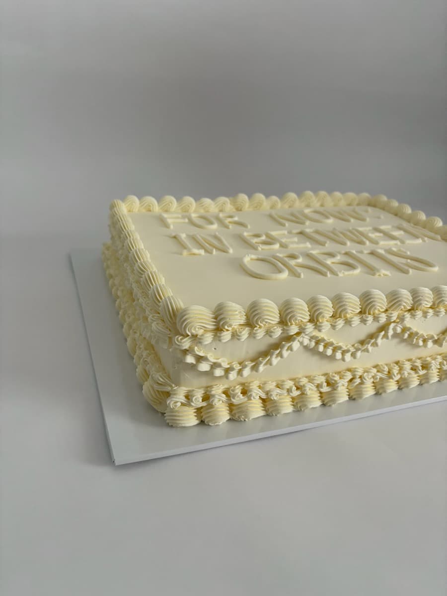Ivory sheet cake with elegant piped script