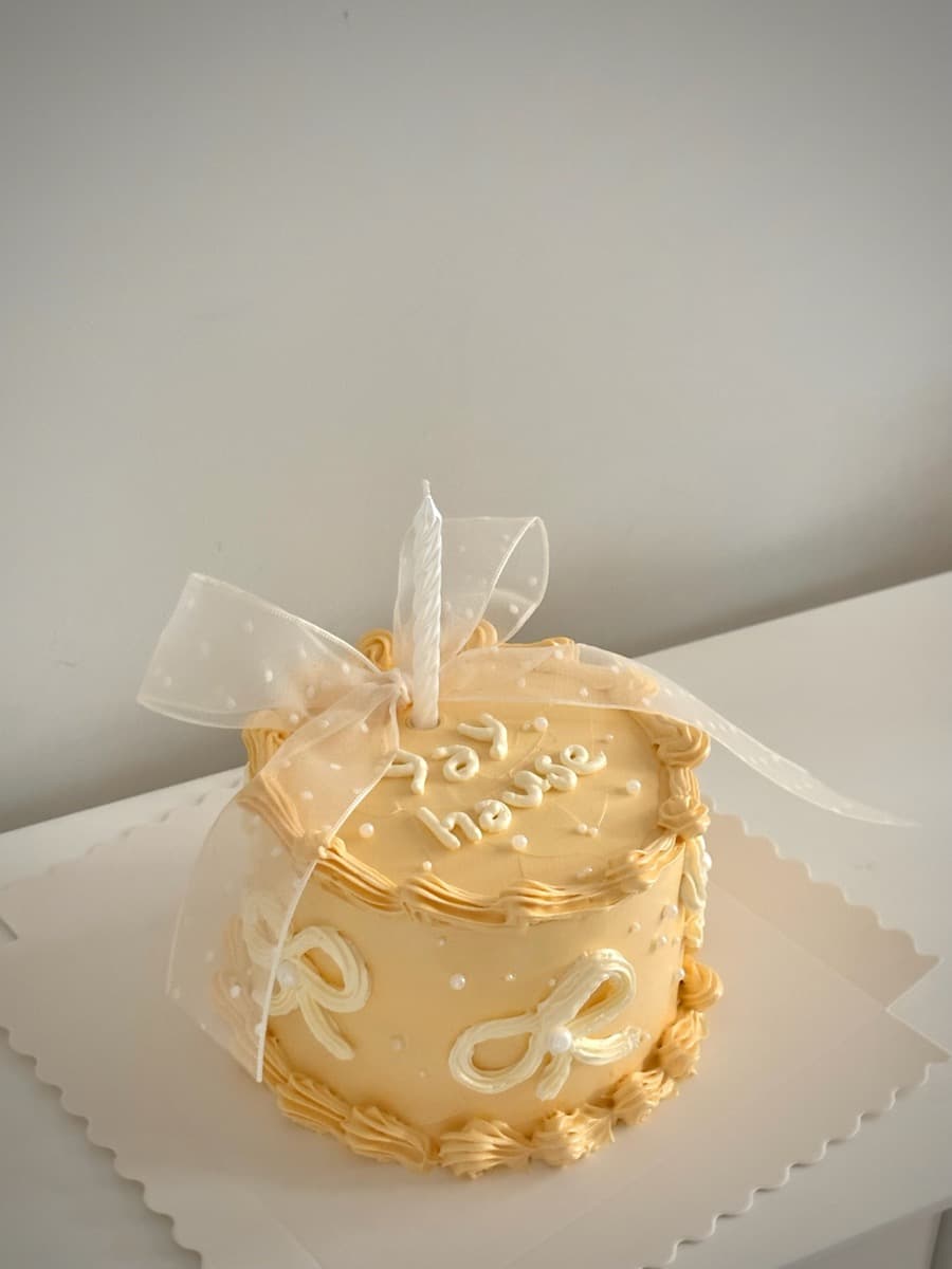Vanilla lace with piped lettering & organza bow