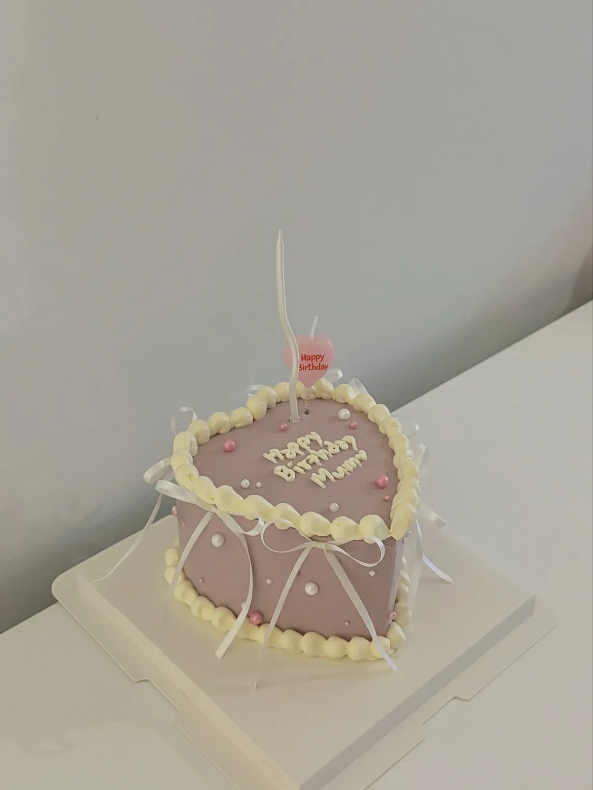 Lilac heart cake with cream piped border, handmade to order by Danine Cakes in Streatham, South London