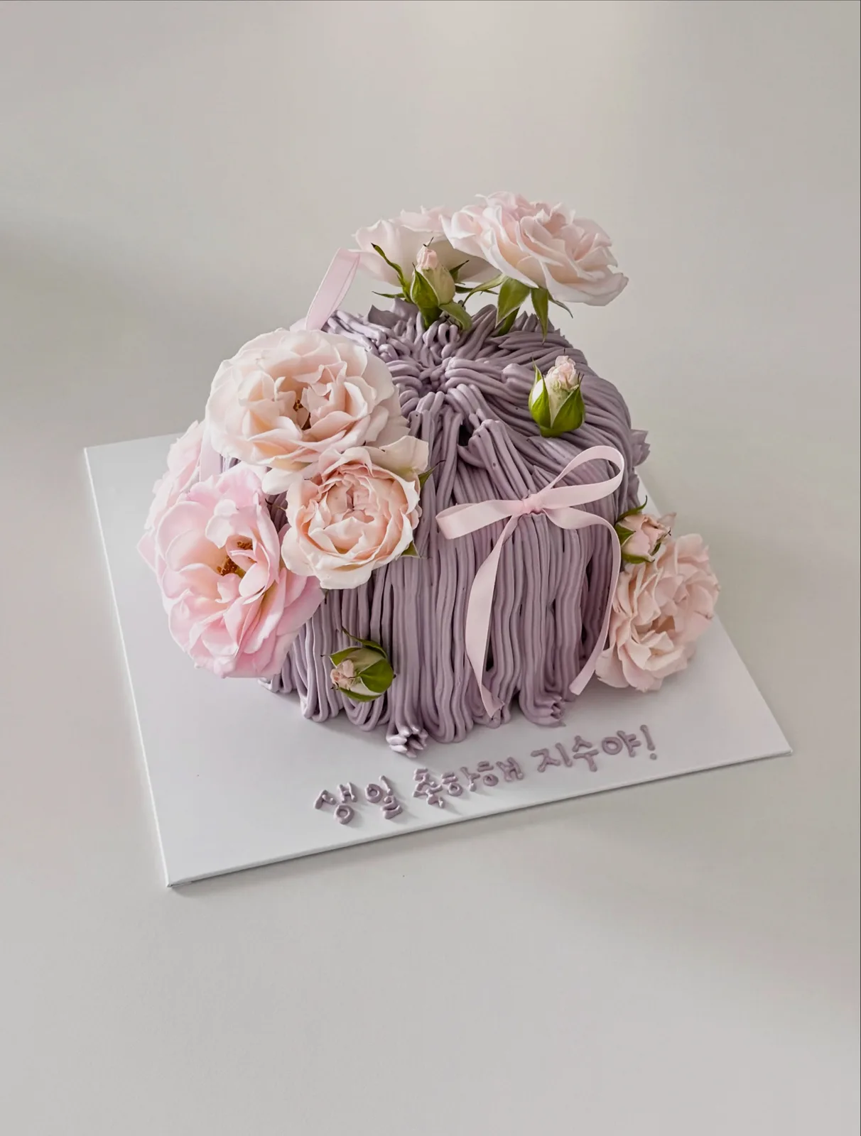 Lilac piped strand cake with fresh roses and ribbon, Korean-inspired custom cake handmade in Streatham, London