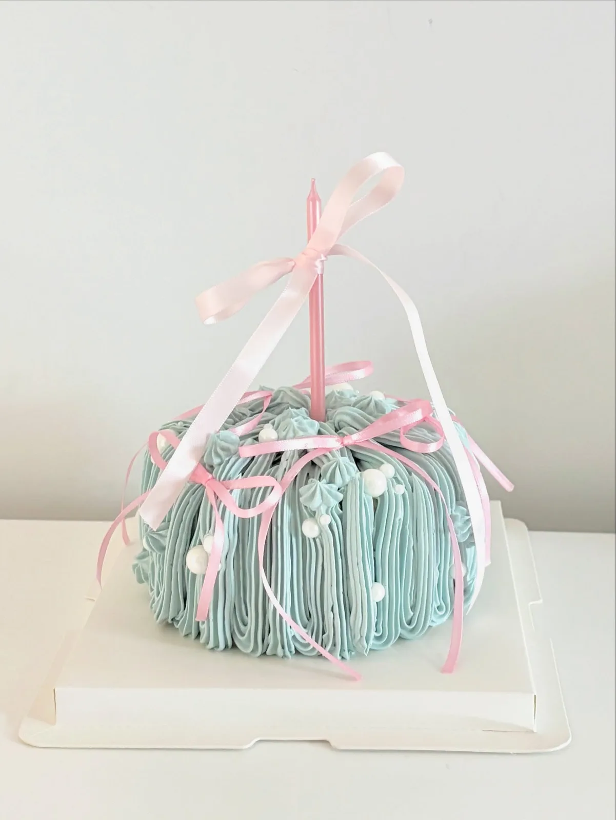Mint piped strand cake with pink satin ribbon, Korean-inspired custom cake handmade in Streatham, London