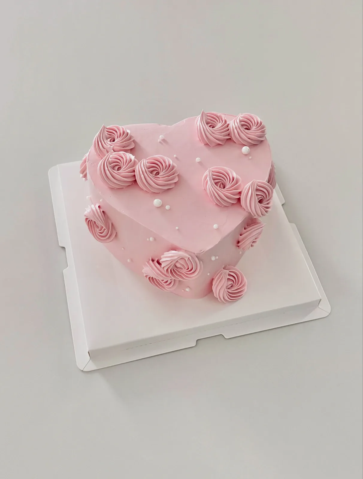 Pink heart cake with buttercream rosettes and pearls, custom cake made in Streatham SW16 - Danine Cakes
