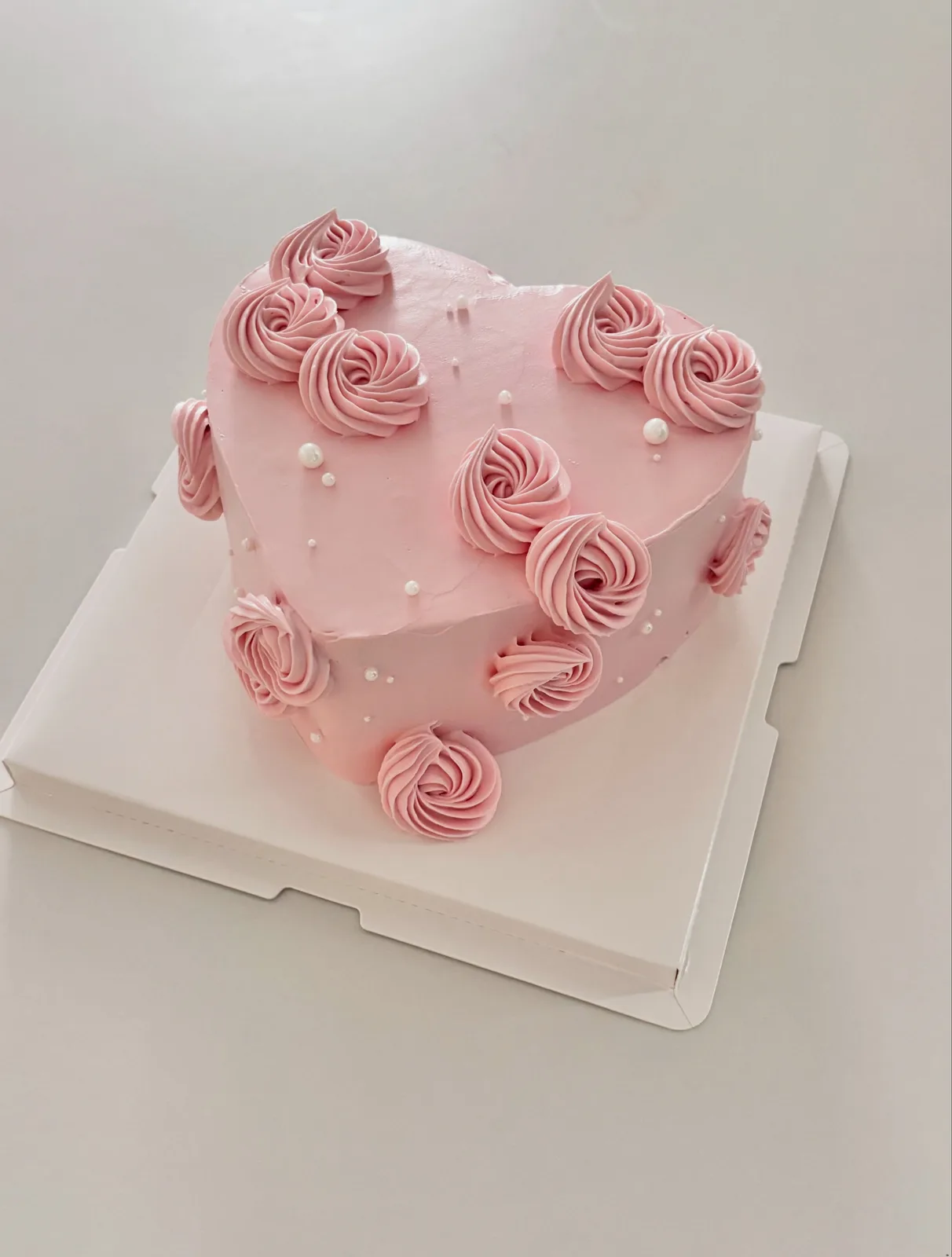 Pink heart cake with buttercream rosettes and pearls, Korean-inspired custom cake handmade in Streatham, London