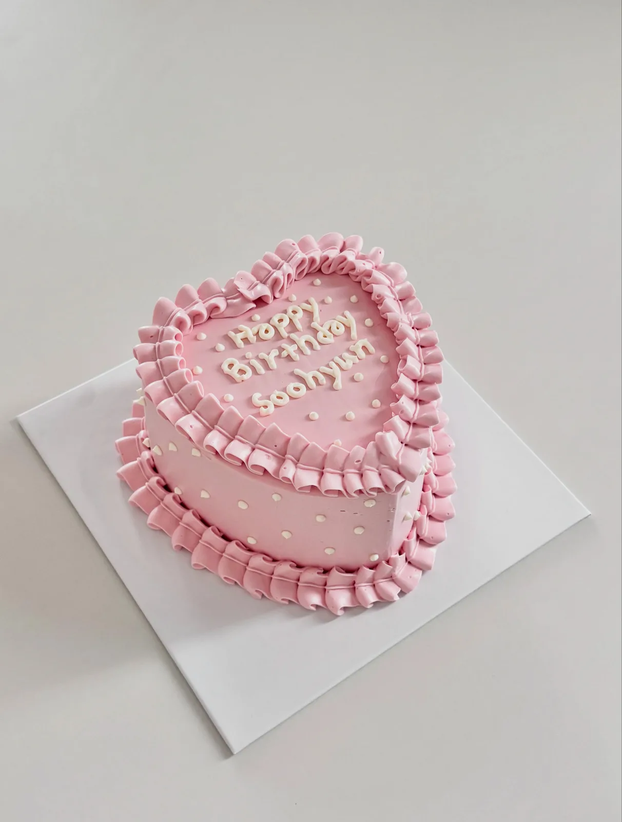 Pink heart cake with ruffle border and lettering, custom cake made in Streatham SW16 - Danine Cakes