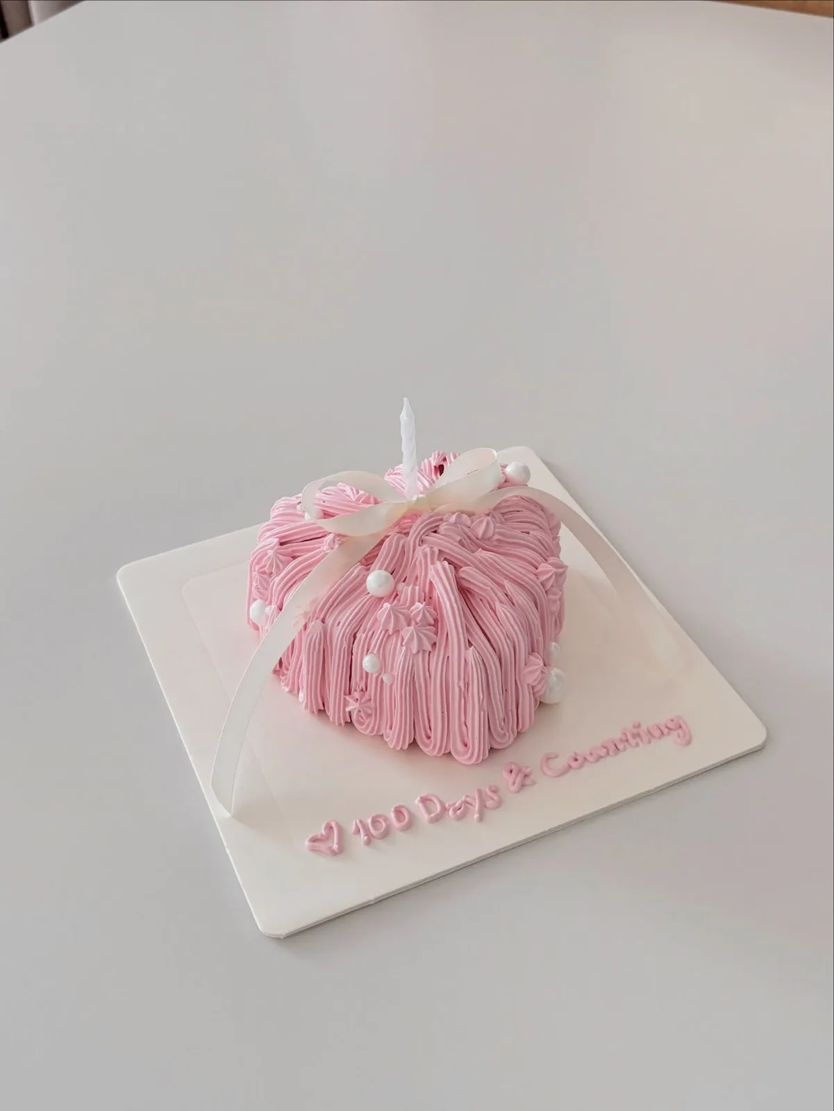 Pink piped dome cake with pearls and ribbon, Korean-inspired custom cake handmade in Streatham, London