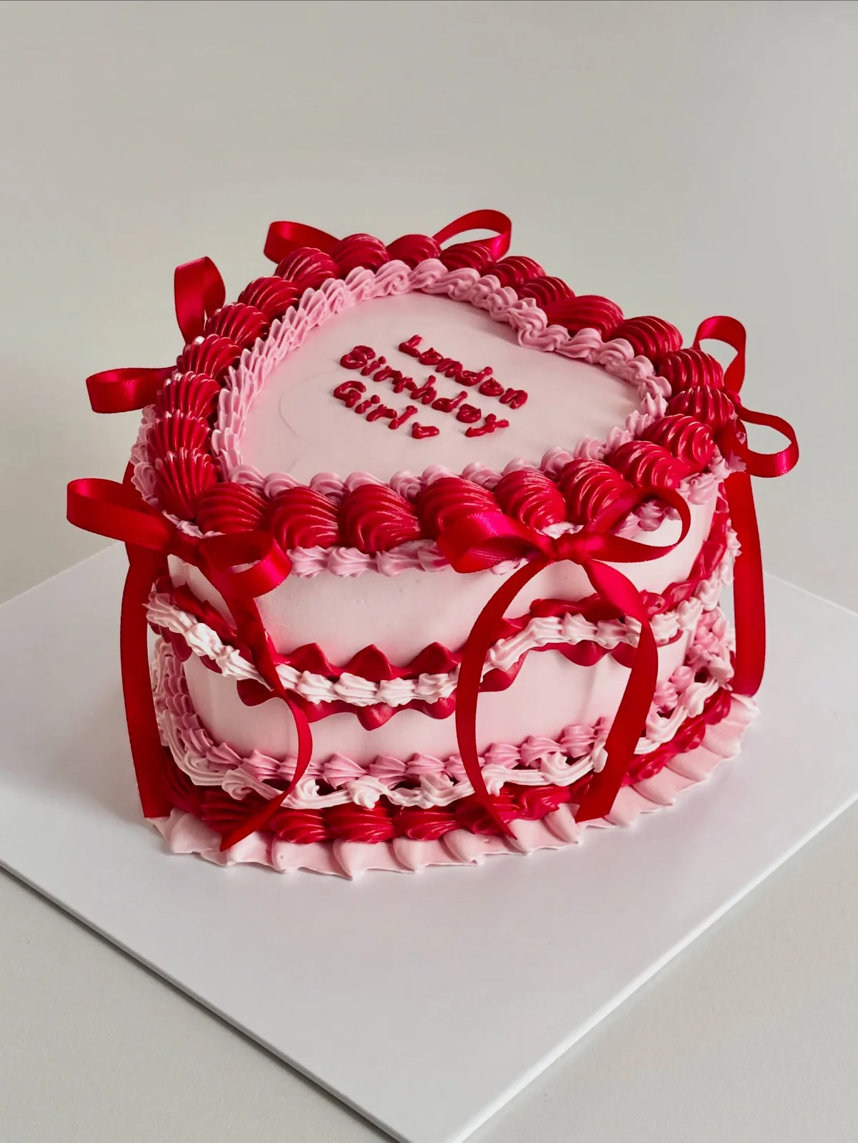 Red and pink heart cake with ribbons and lace piping, custom cake made in Streatham SW16 - Danine Cakes