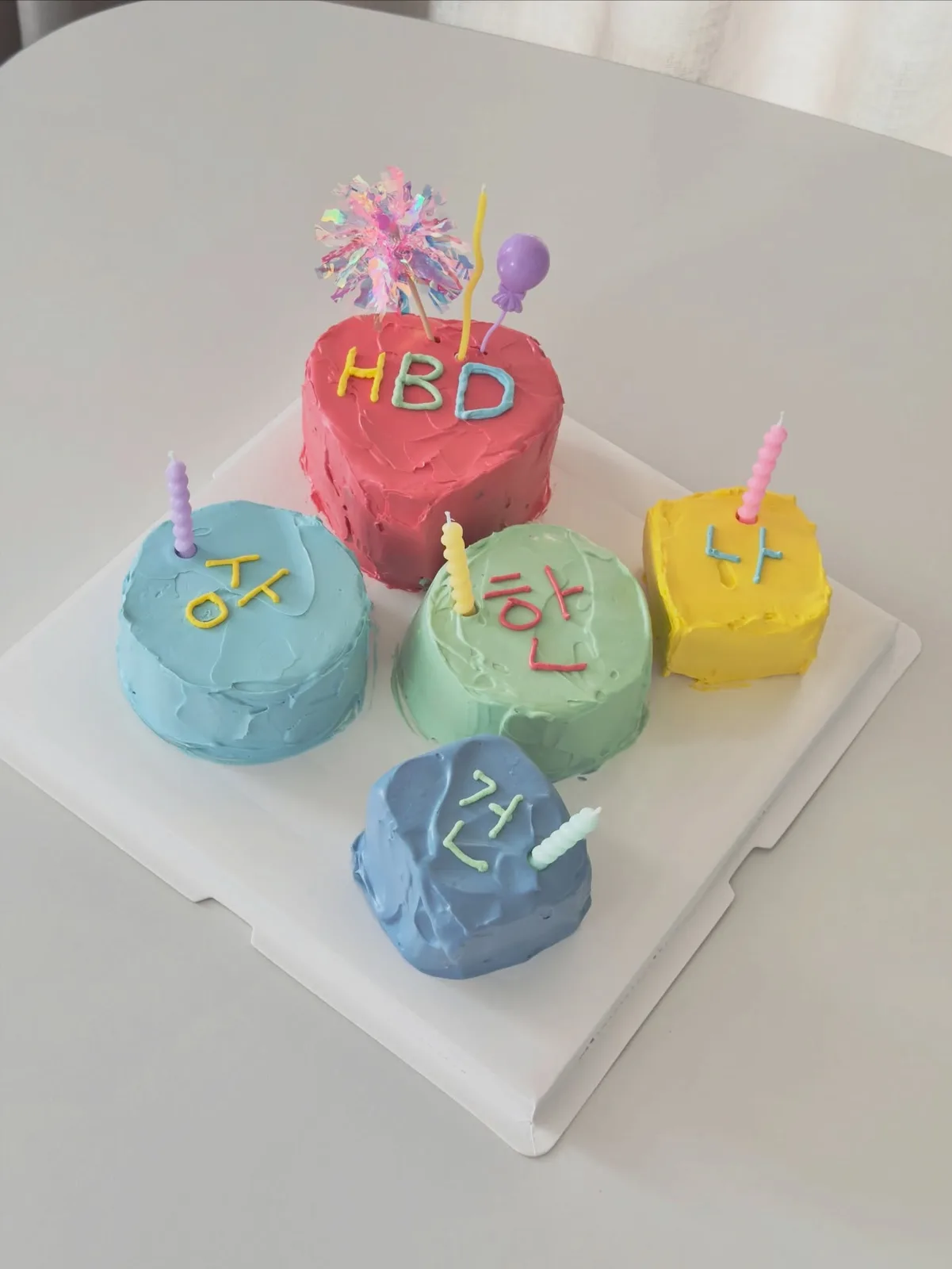 Set of pastel mini cakes with candles and lettering, Korean-inspired custom cake handmade in Streatham, London