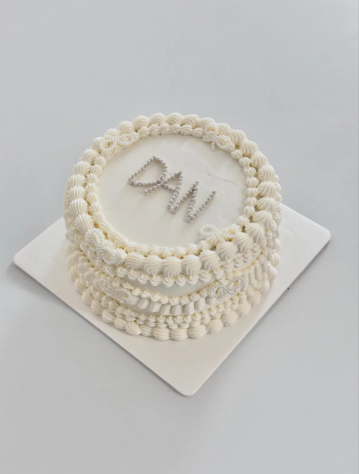 White cake with pearl lettering and piped border, custom cake made in Streatham SW16 - Danine Cakes