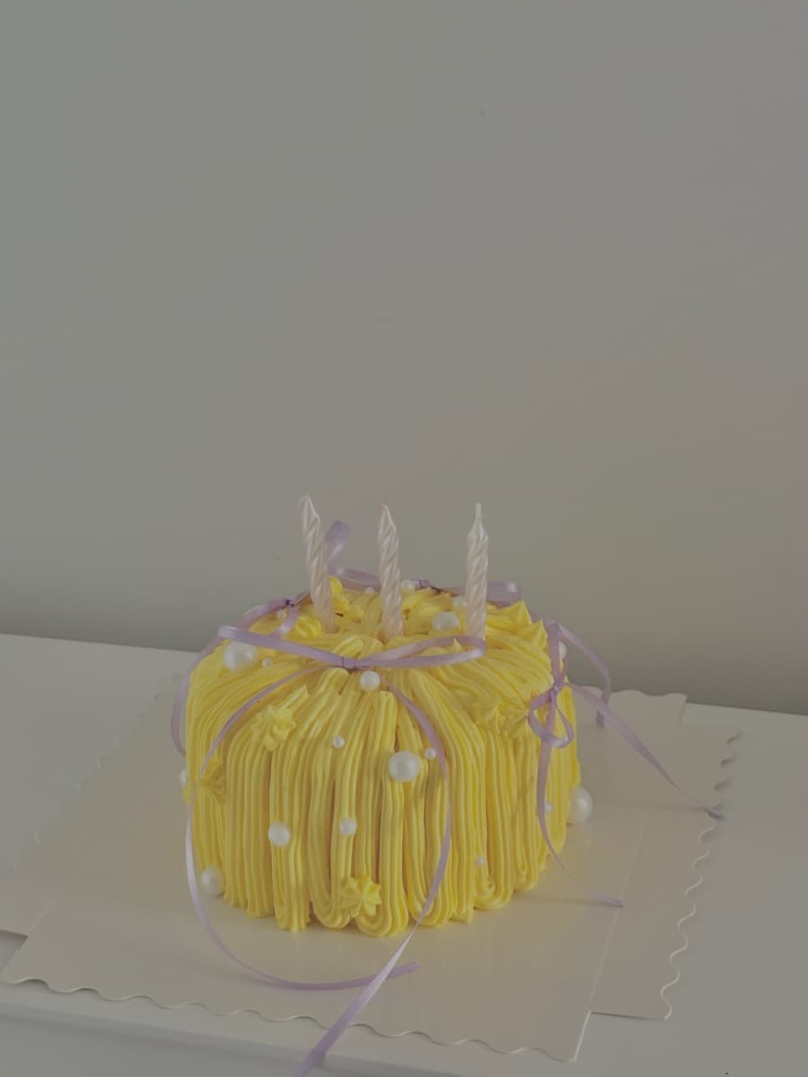 Yellow dome with lilac ribbons & three candles